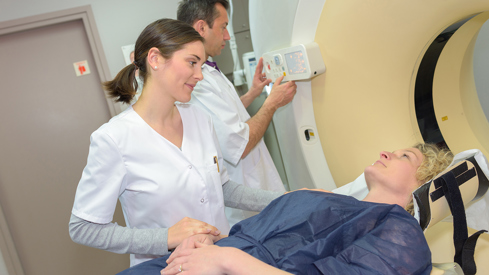 Female health personnel is attending a female patient