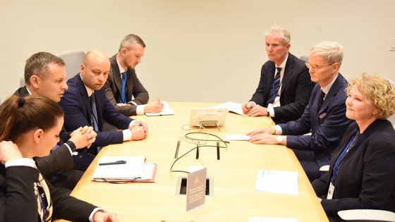 People sitting around a meeting table