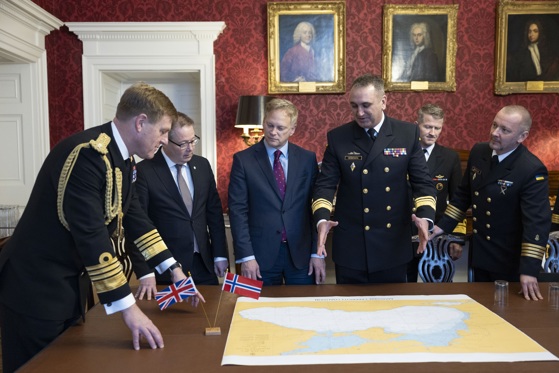 Secretary of State for Defence Grant Shapps (centre), seen here with the Norwegian Defence minister, Bjørn Arild Gram (left) and Commander of the Ukrainian Navy Olekesiy Neizhpapa (right) at a trilateral agreement between the UK, Norway, and Ukraine Dec. 11 2023.