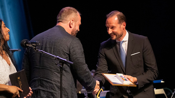 His Royal Highness Crown Prince Haakon and Espen Evjenth on stage in the Norwegian Opera House.