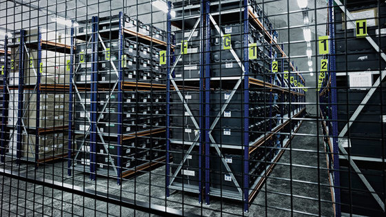 The seeds are packed in sealed bags inside sealed crates, and stacked on tall shelf racks in the vault.